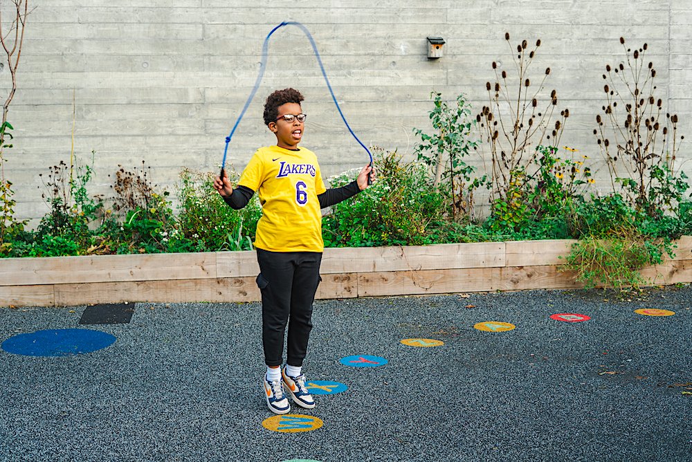 Child skipping in the playground at St Matthew's Sandymount.jpg