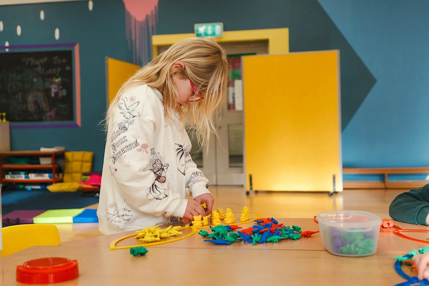Child working at a desk at St Matthew's Sandymount.jpg