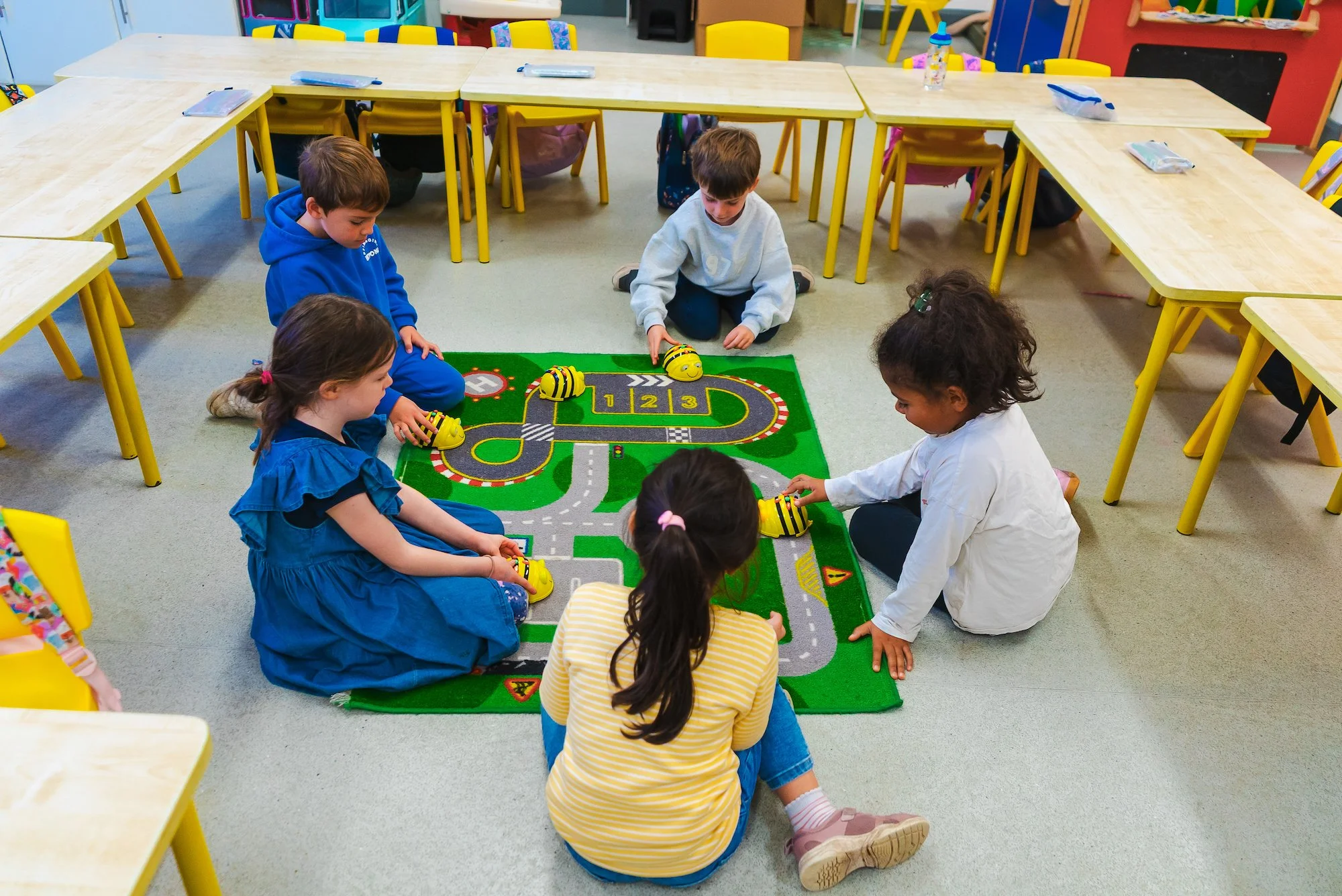 Children playing with coding bees at St Matthew's NS.jpg