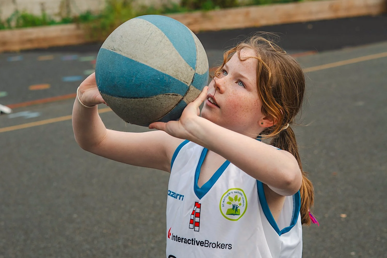 Girl playing basketball, about to shoot.jpg