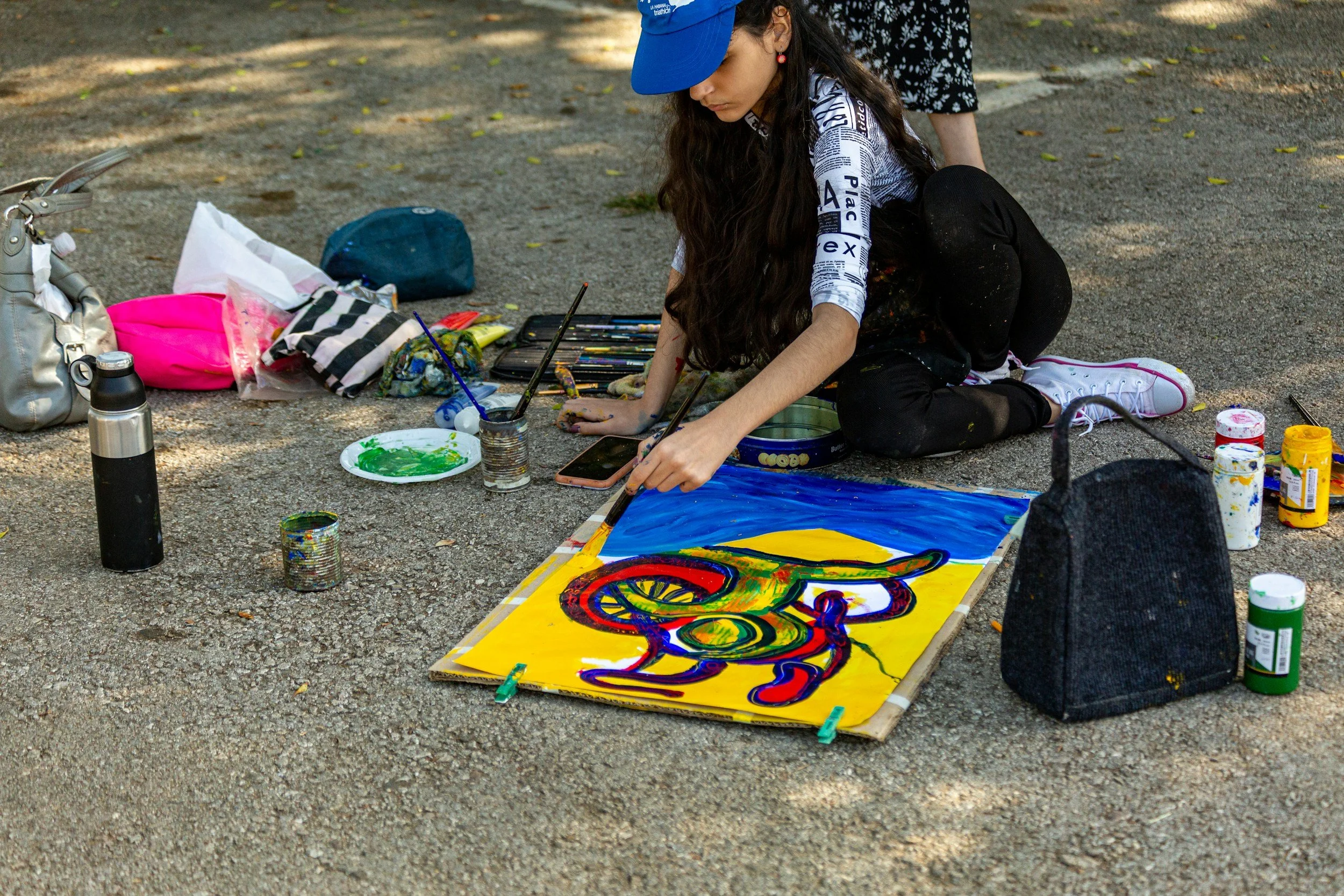 a women painting outdoors finding fulfillment in the experience