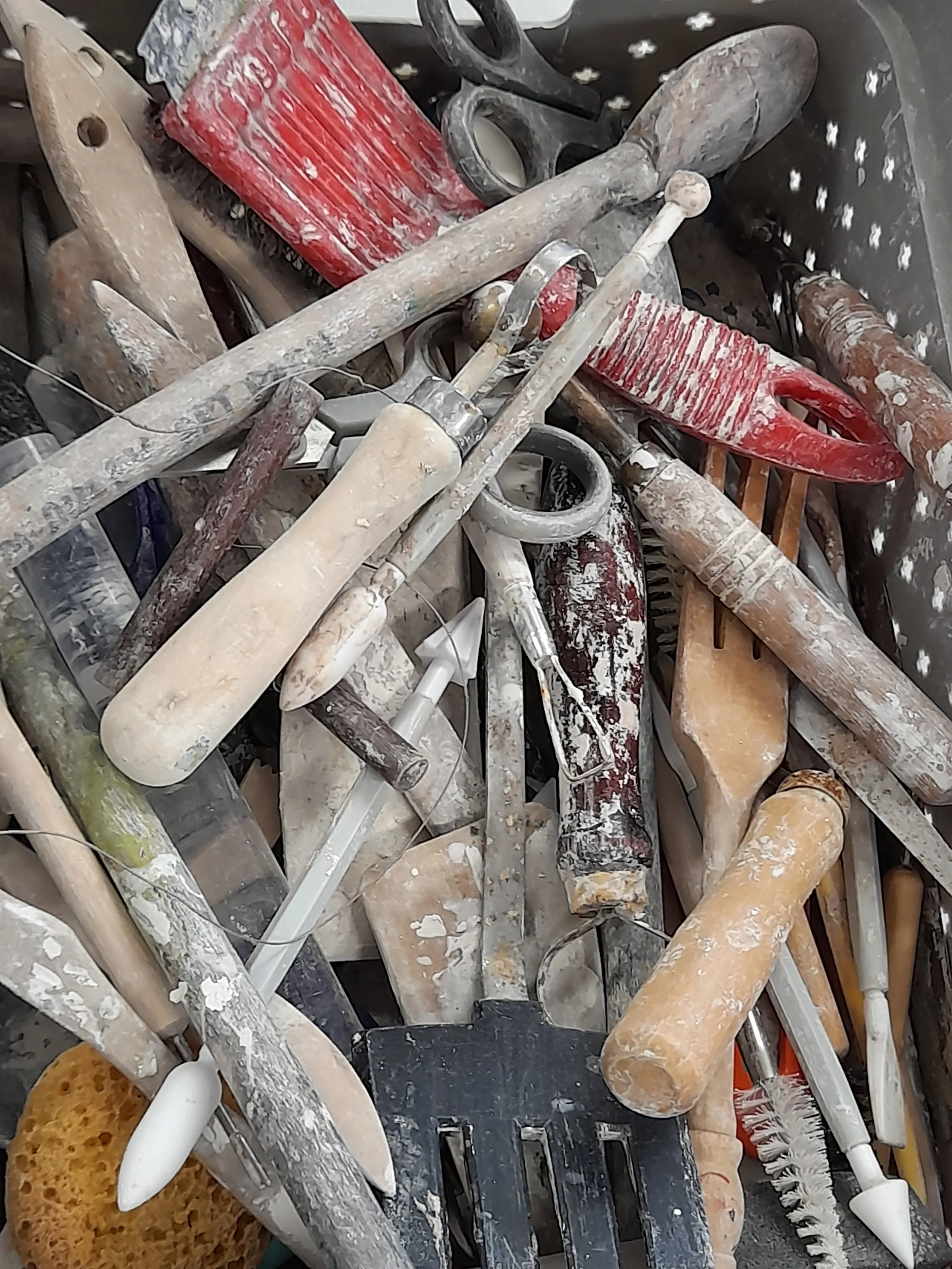 A array of pottery tools ready for use.