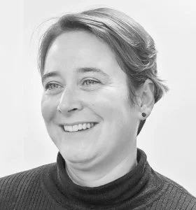 Black and white portrait of a woman smiling