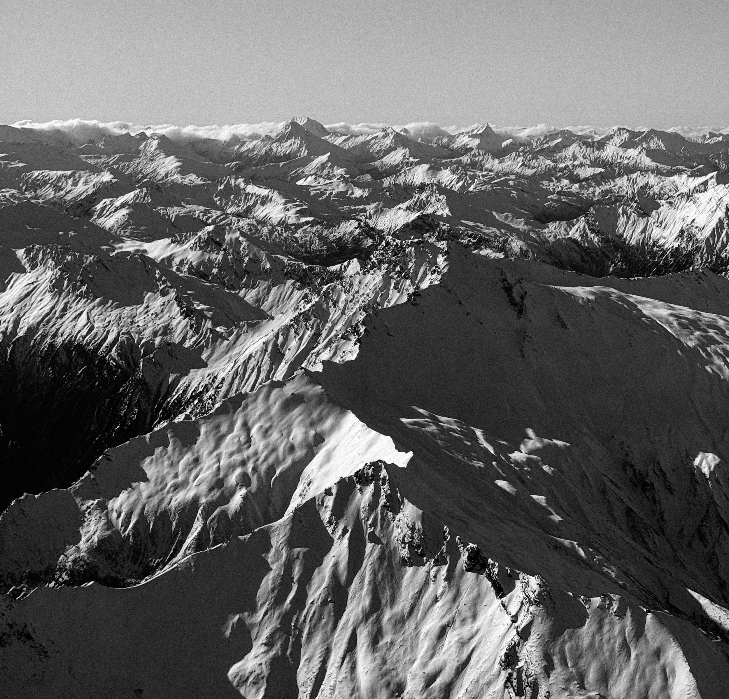 The Canadian snow-capped mountains in black and white.