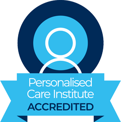 Logo of the Personalised Care Institute indicating accreditation with a blue circular emblem and ribbon reading 'Accredited'.