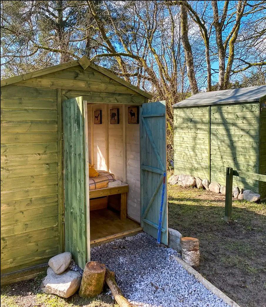 Bed in a shed interior.png
