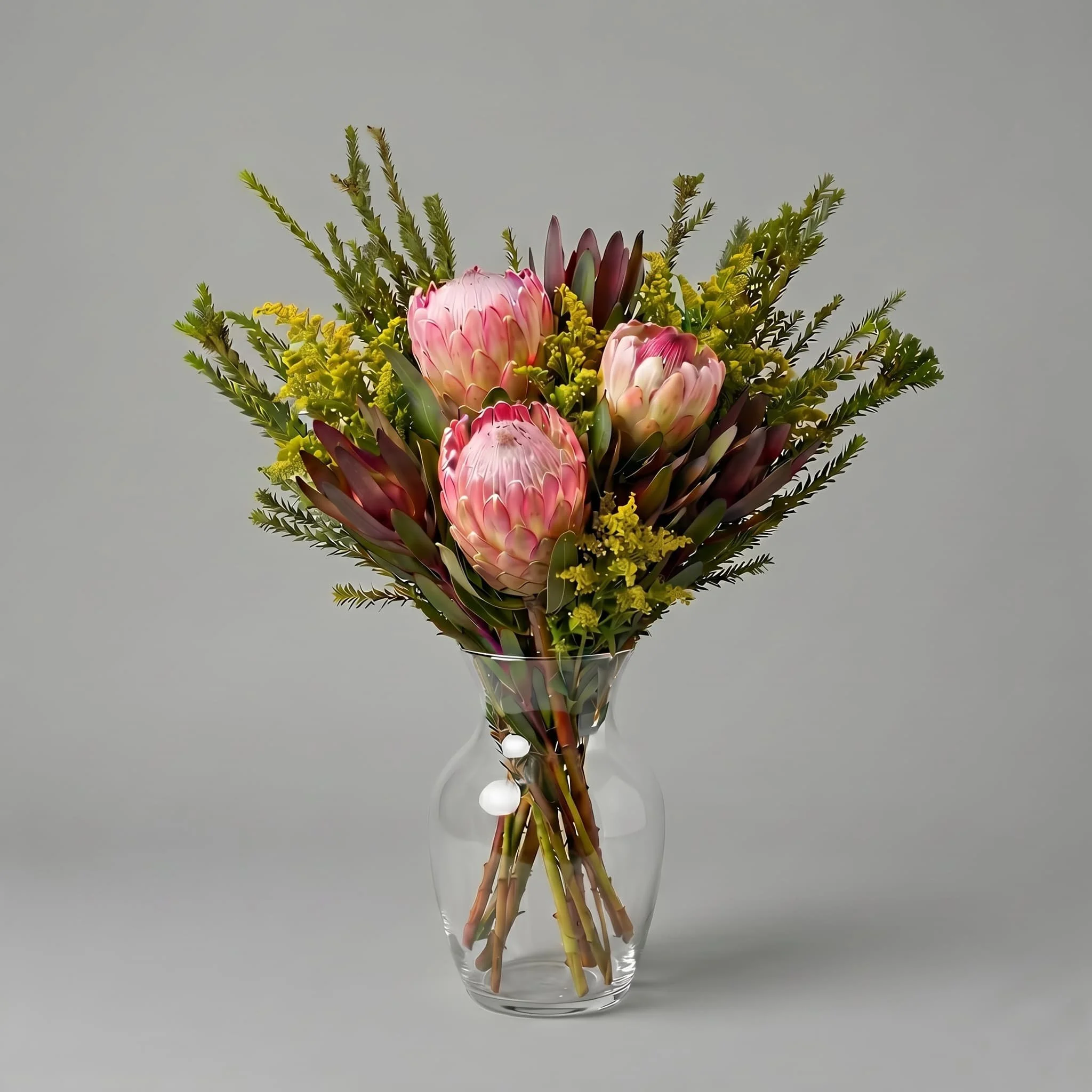 Australian native bouquet with pink protea in clear glass vase by HORA Flowers Perth