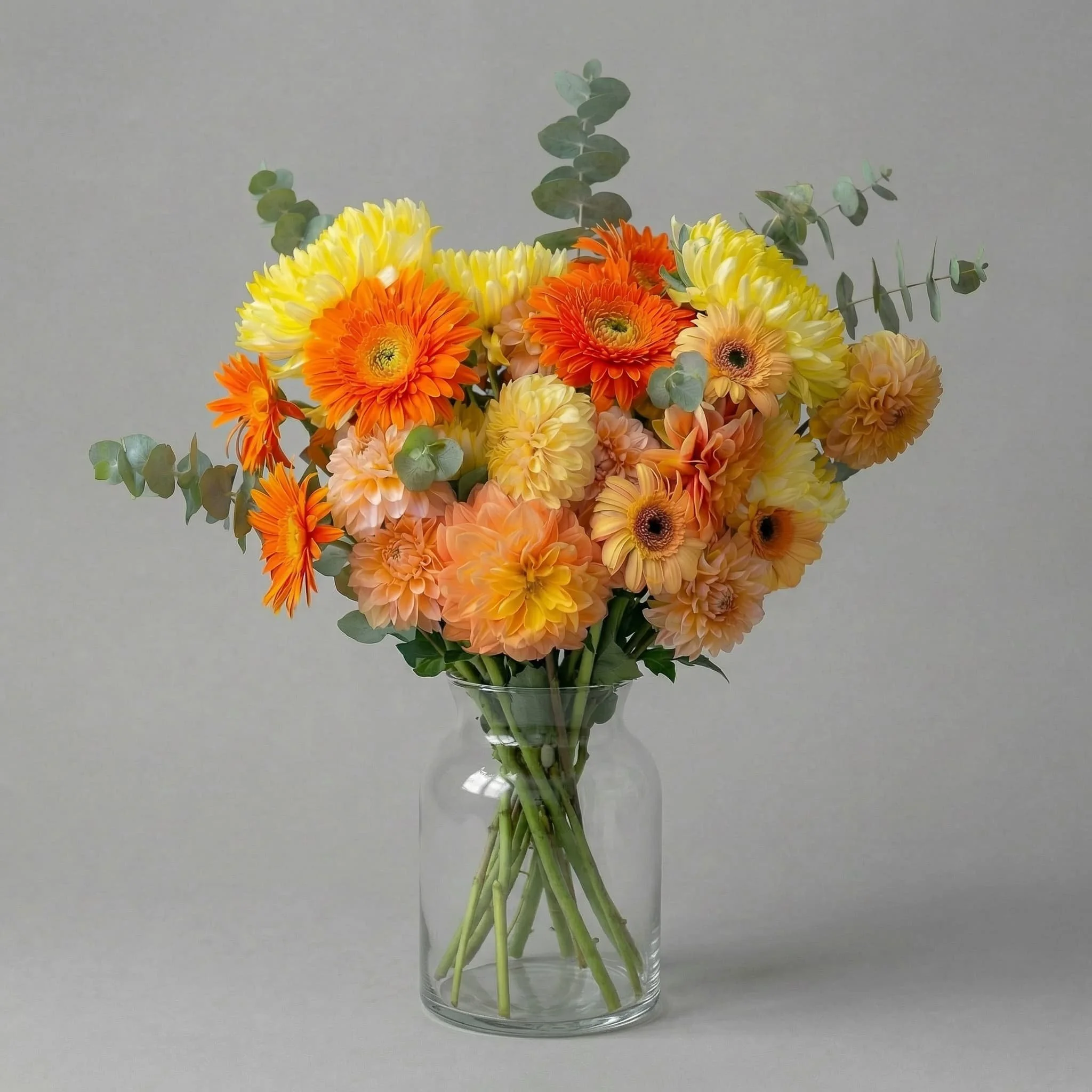 easonal bouquet in a clear glass vase by HORA Flowers Perth