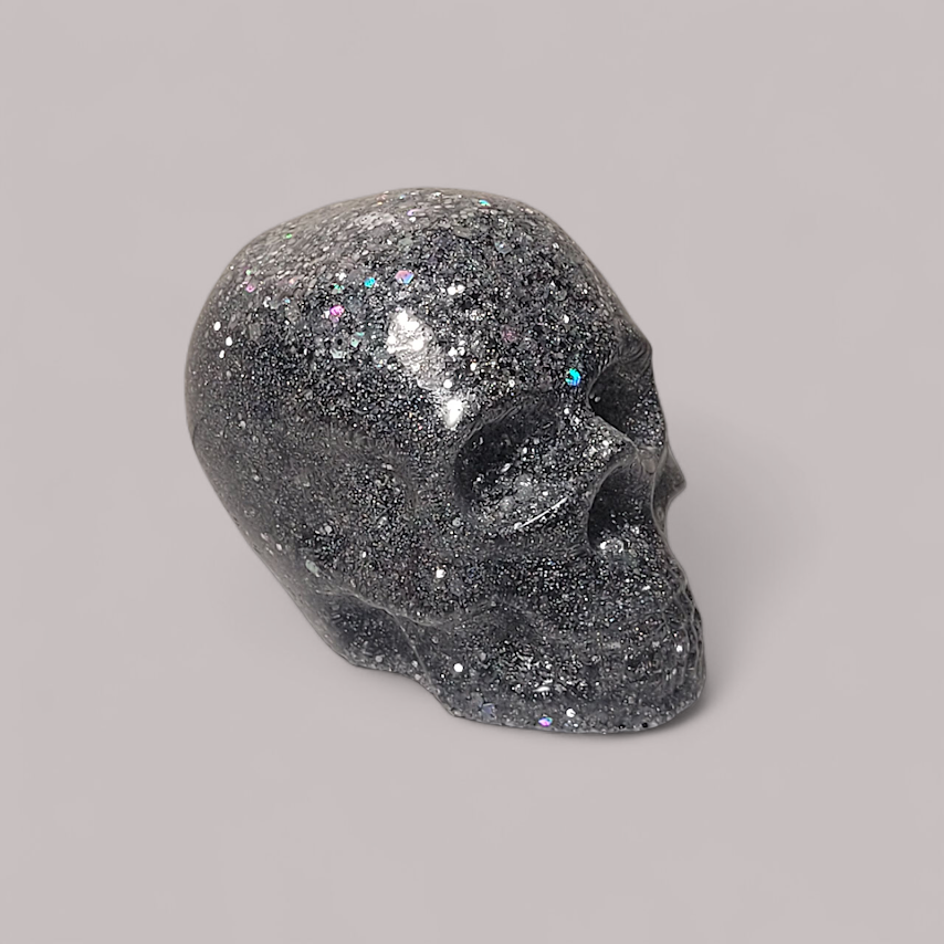 The Stardust Sentinel
“Born from the silver ash of a dying star.”
The Stardust Sentinel is a 1-of-1 original guardian, hand-cast in crystal-clear resin and saturated with thousands of microscopic holographic flakes and silver metallic pigments. Its s
