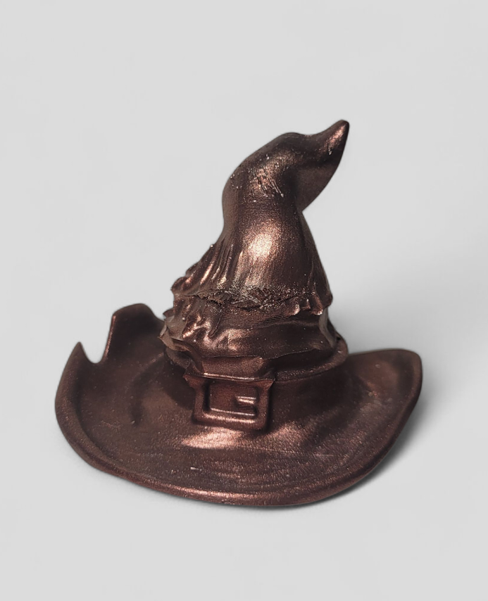 The Hearth-Witch’s Heirloom
“The strongest magic is often worn until it fits like a second skin.”
The Hearth-Witch’s Heirloom is a 1-of-1 original relic, hand-cast in durable artisan resin and finished with a weathered copper pigment paint. Unlike th