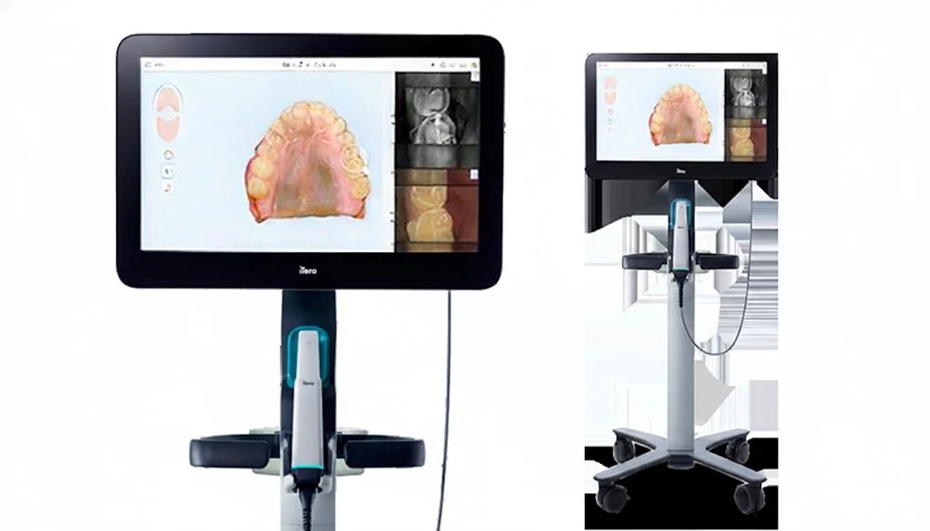 Dental digital scanner setup with a large touchscreen monitor displaying 3D dental images of a patient's upper teeth and smaller images on the side, mounted on a mobile stand with a scanner handpiece hanging from a cord.