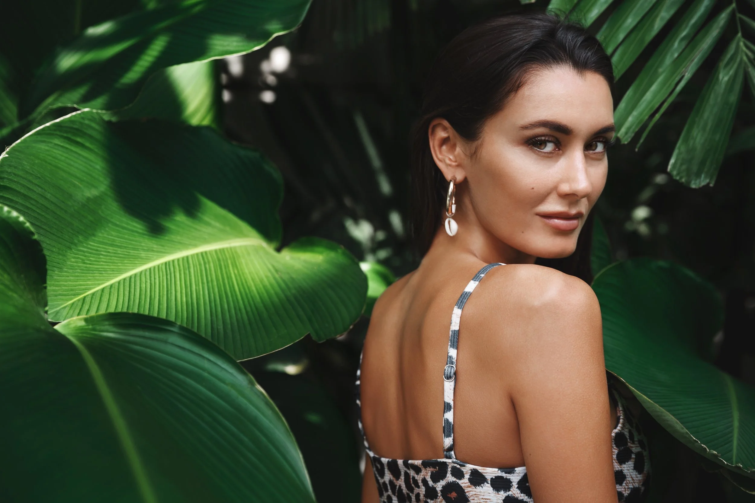 Beyond tropical-vacation-travelling-concept-sexy-brunette-woman-bikini-standing-jungle-nature-turn-back-camera-near-green-palm-leaves-holiday.jpg