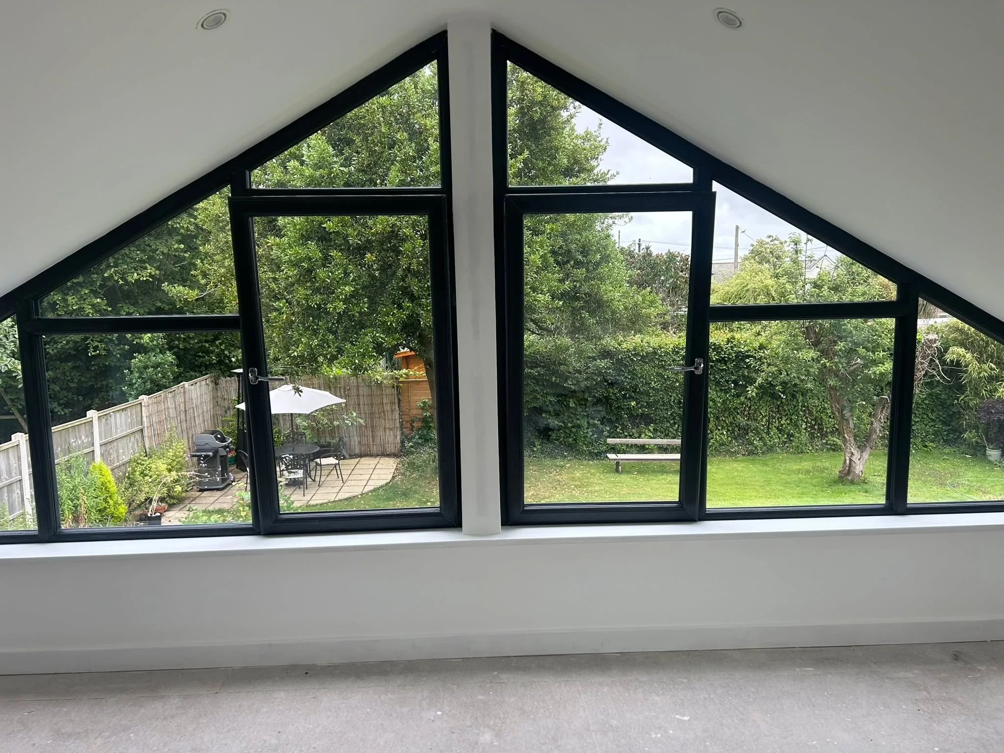 A fully glazed gable end on this pitched roof dormer extension adds a stunning feature to the loft conversion, offering beautiful, uninterrupted views of the garden. A fantastic addition to our clients property seamlessly blending style and function!
