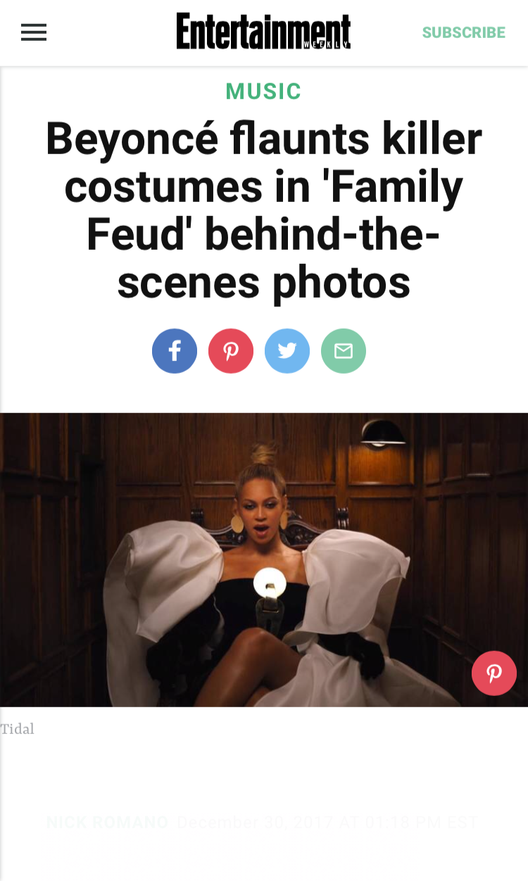 Beyoncé sitting in a wood-paneled room wearing a black and white dramatic dress with large white puffed sleeves, holding a phone, with a surprised expression.