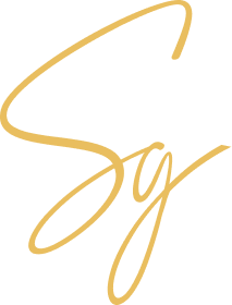 The word 'Say' written in elegant, cursive gold script on a black background.