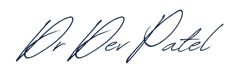 Close-up of handwritten cursive signature in dark ink on a black background.