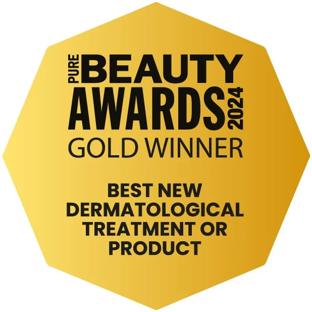 Gold-colored badge with black text that reads "Pure Beauty Awards 2024 Gold Winner Best New Dermatological Treatment or Product."