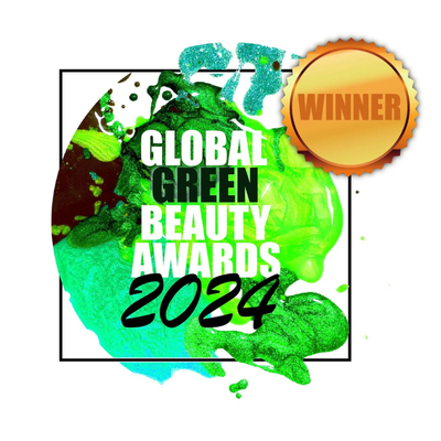 Design for the 2024 Global Green Beauty Awards, featuring a green splash background, a golden 'Winner' badge, and text 'Global Green Beauty Awards 2024'.