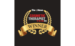 Cosmetic Therapist of the Year award badge with gold laurel and ribbon, featuring the logo of The News.