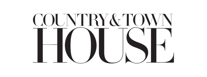 Text graphic with the words 'Country & Town House' in large, black, elegant font on a white background.