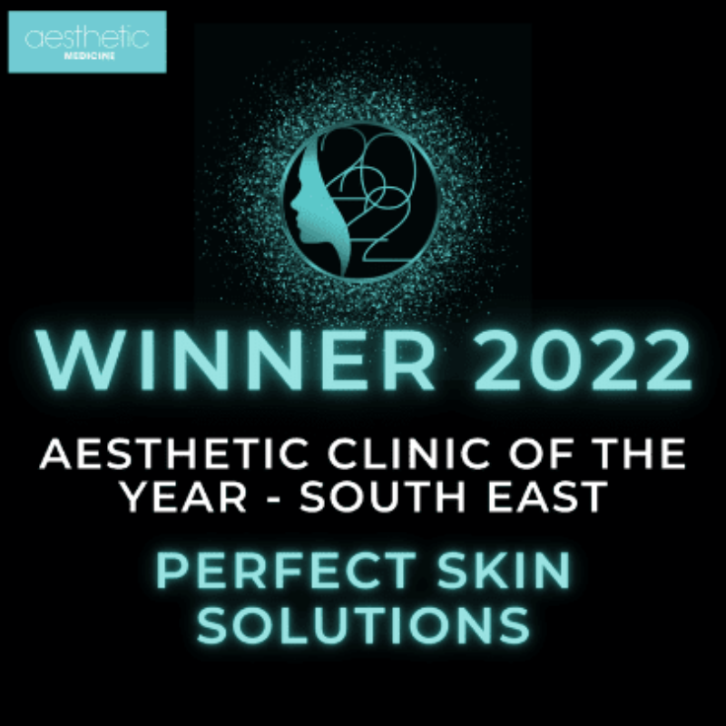An awards graphic with a black background, featuring a glowing teal logo of a woman's profile inside a circle, and text indicating the winner of the 2022 Aesthetic Clinic of the Year - South East, for Perfect Skin Solutions.