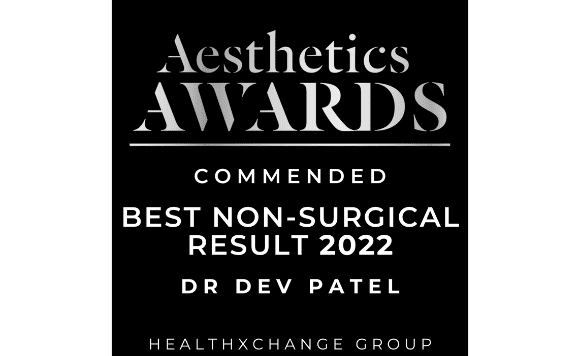 A black and white award certificate for the Aesthetics Awards, recognizing Dr. Dev Patel as Commended for Best Non-Surgical Result in 2022, issued by HealthXChange Group.