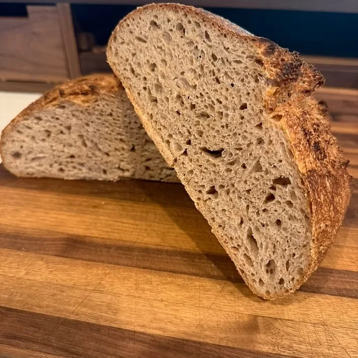  Heritage Grain Country Bread  This naturally leavened sourdough celebrates the character of old-world grains, blending spelt, rye, and whole wheat for a deep, earthy flavor and satisfying complexity. The loaf bakes to a caramel-brown crust with a ru
