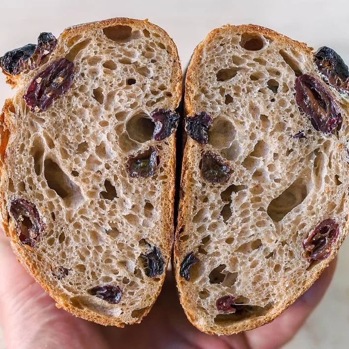  Cinnamon Raisin Sourdough  Cinnamon Raisin Sourdough is a warm, comforting loaf that blends the gentle tang of natural fermentation with the sweetness of plump raisins and aromatic cinnamon. Each slice reveals a tender, beautifully swirled crumb wit