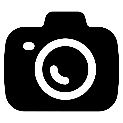 Black silhouette of a person with arms raised and a crown or halo above their head, standing on a mountain or hill with a cross in the background.