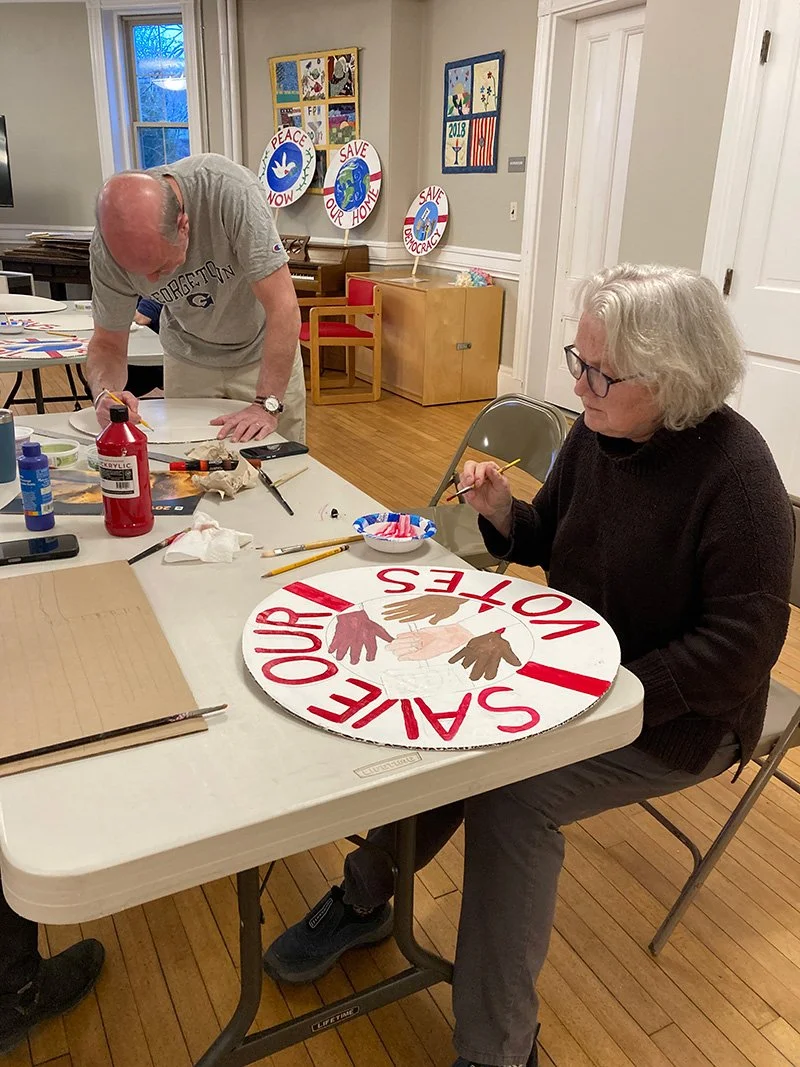 Watertown residents making signs for a stand out
