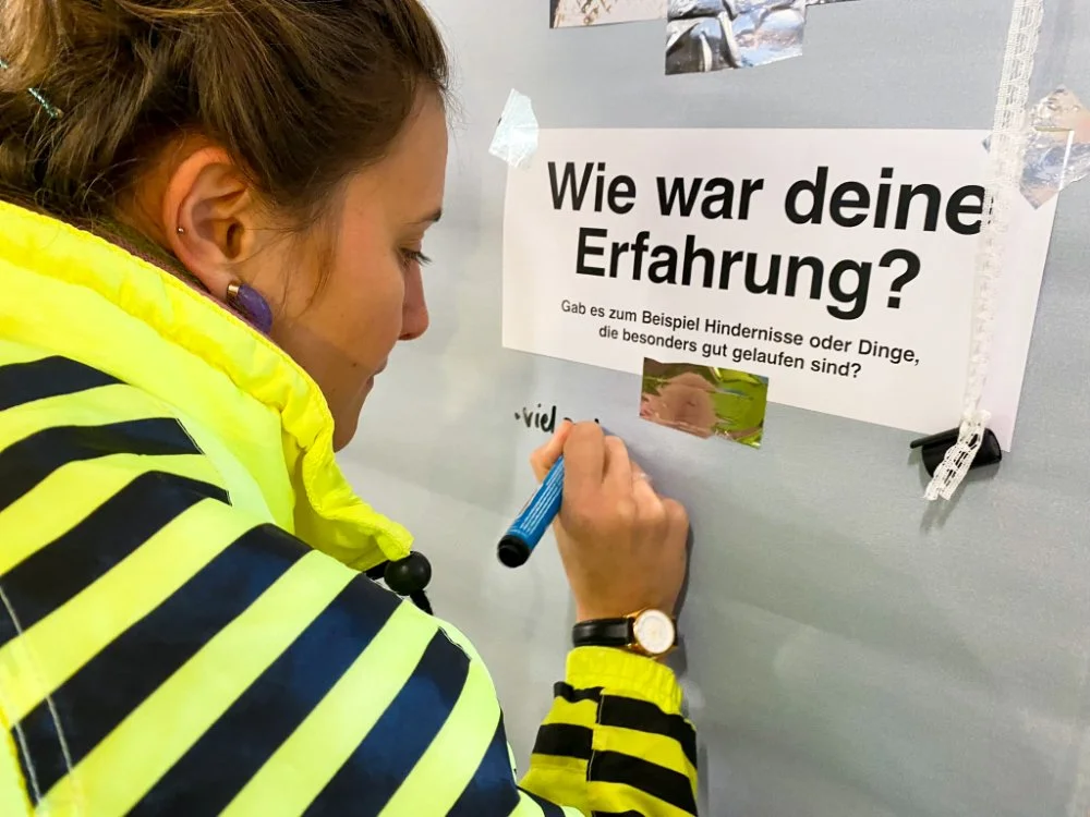 Person writing down on a poster