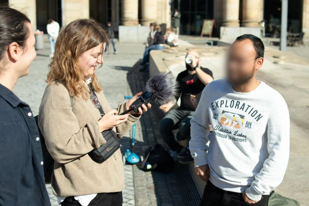 Person getting interviewed by another person