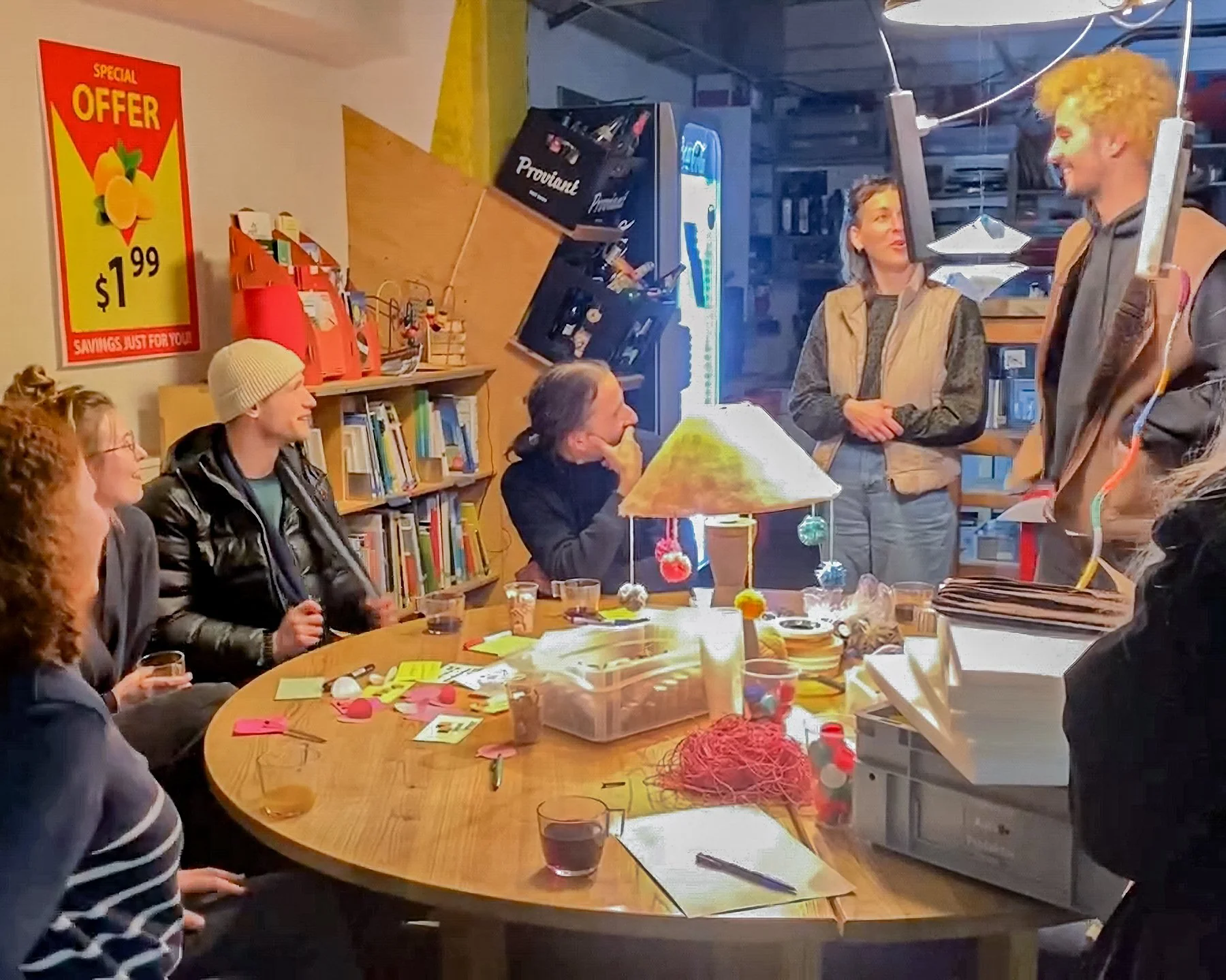 People around a table with sticky notes