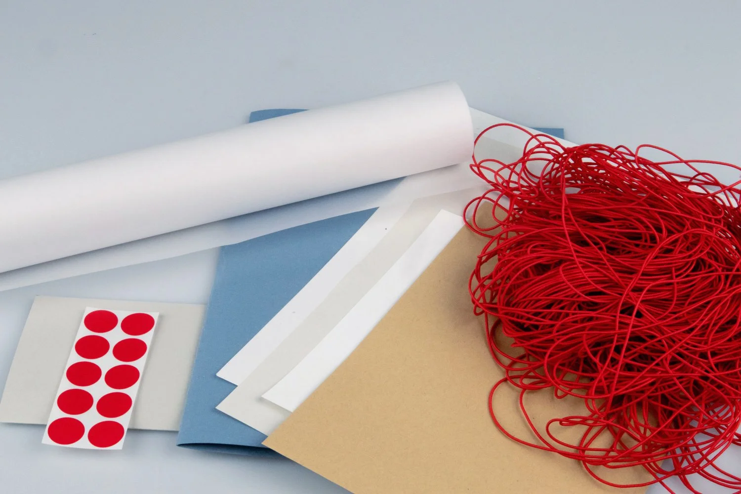 Mix of different papers, stickers and string