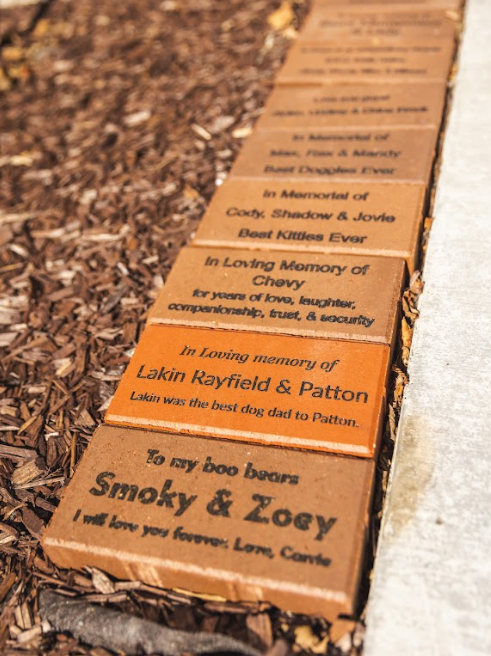 A collection of memorial bricks at Sevier County Animal Shelter