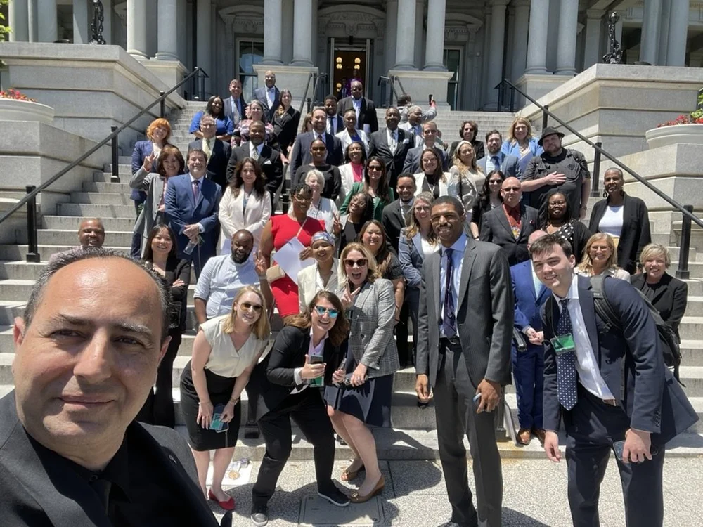 International business delegation on the steps of a government building