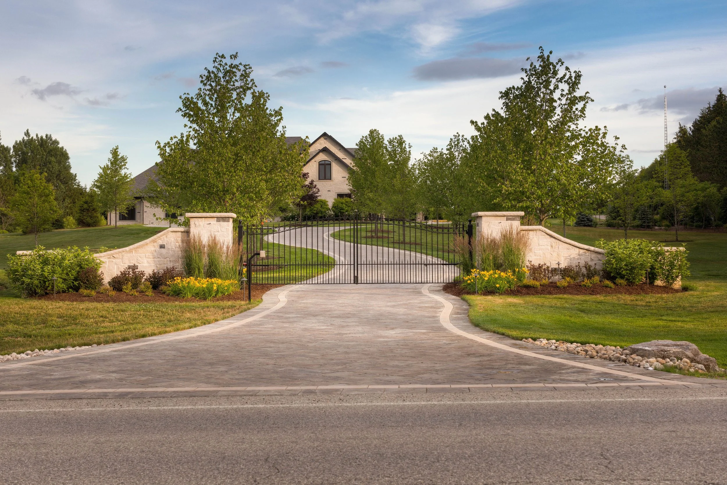 This front entrance is a show stopper. Planted with seasonality in mind, it looks good year round. The sweeping tree lined driveway invites you in. 