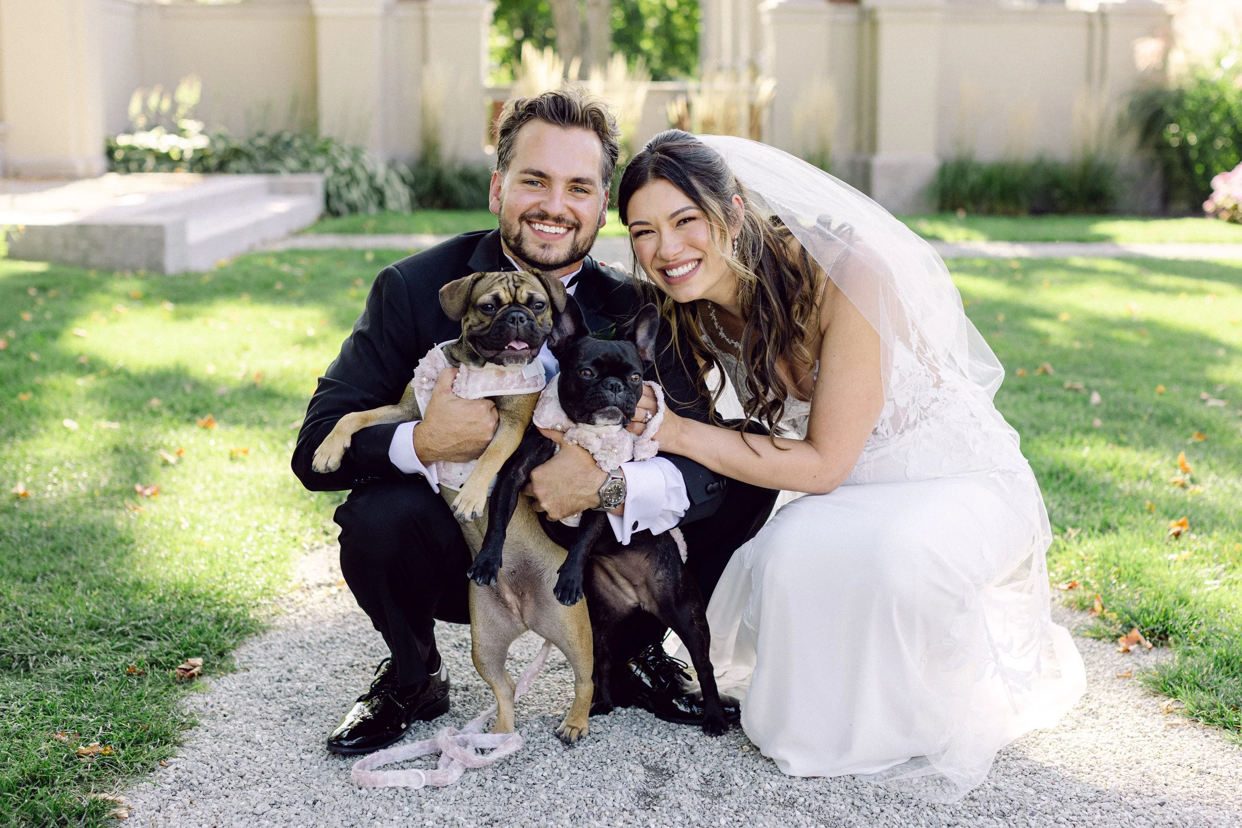 Couple posing with the dog during wedding at The Amour House in Lake Forest Illinois.