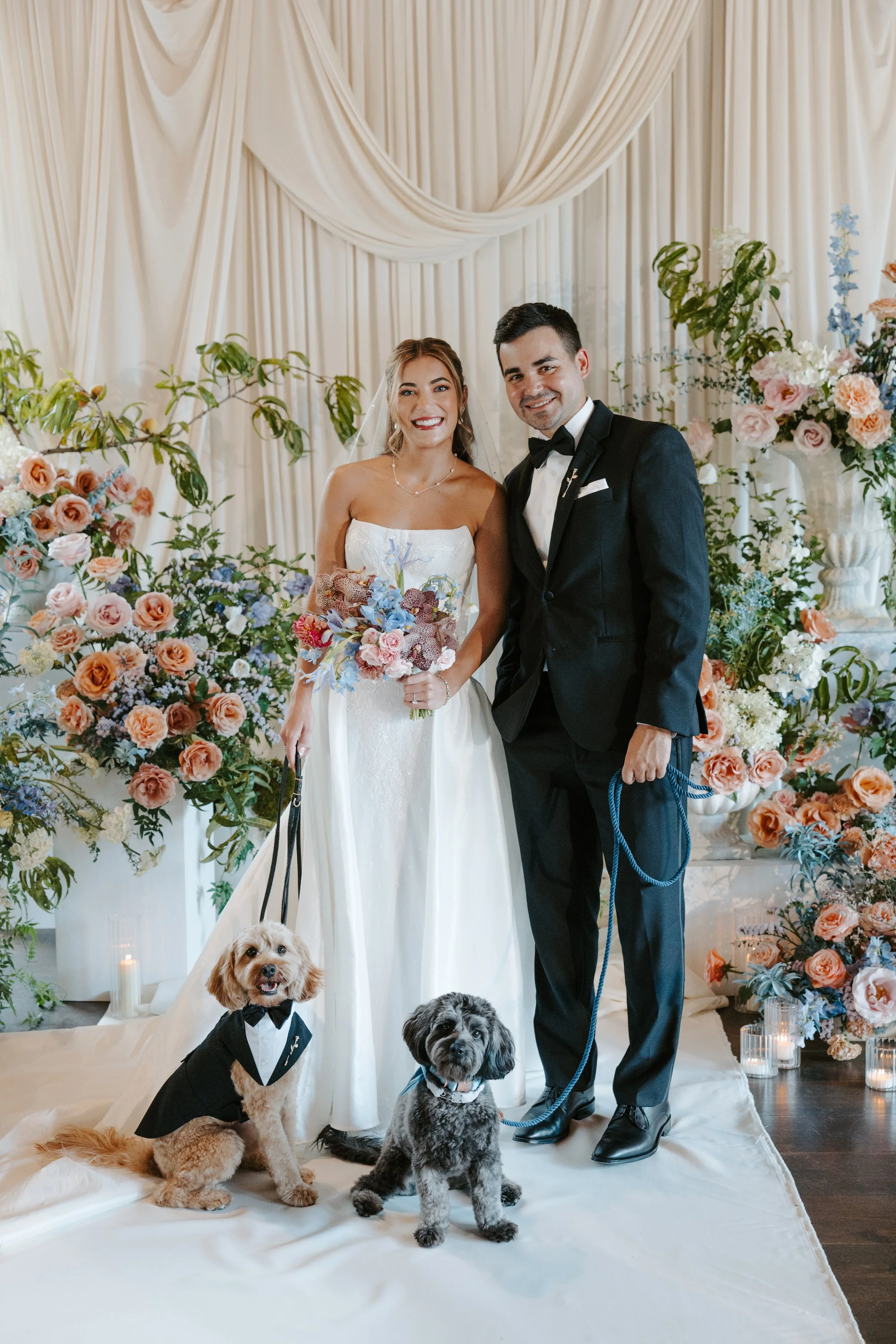 Luxury Chicago wedding with two dogs in tuxedos coordinated by Wags of Love dog wedding attendant.