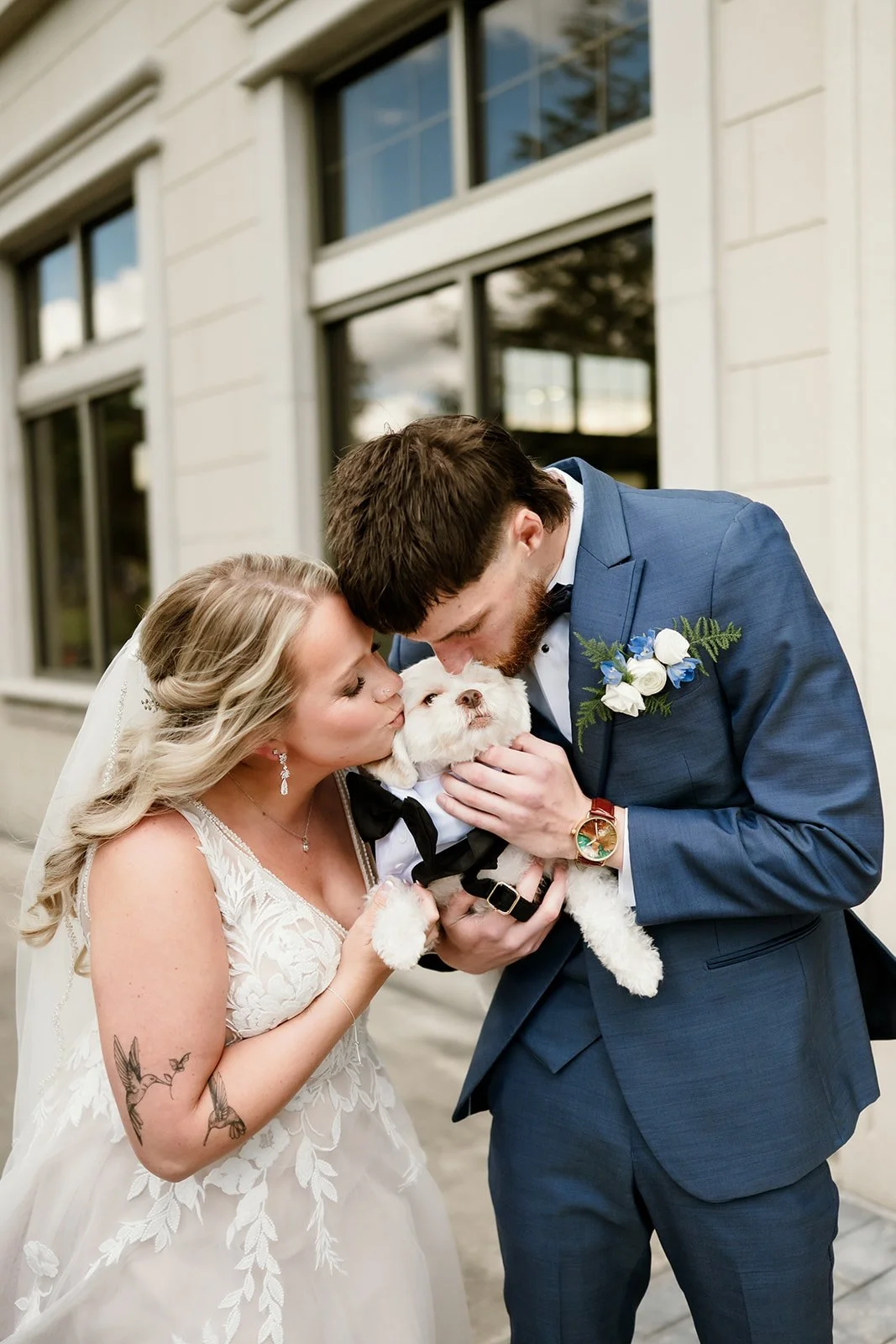 Couple having their first look with their dog at the Veterans Terrance in Burlington Wisconsin. 