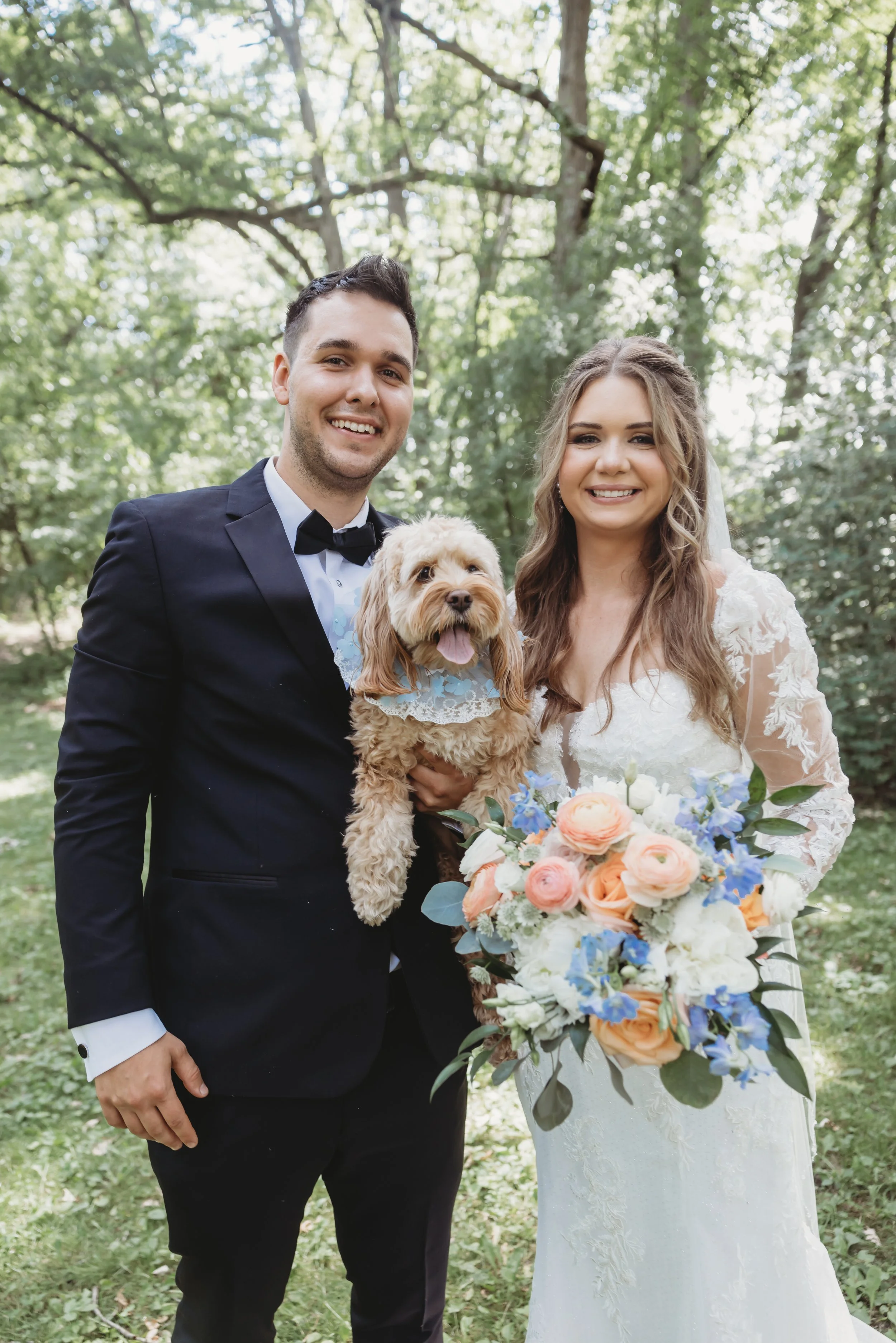 Professional dog wedding attendant supporting couple during Chicago wedding portraits