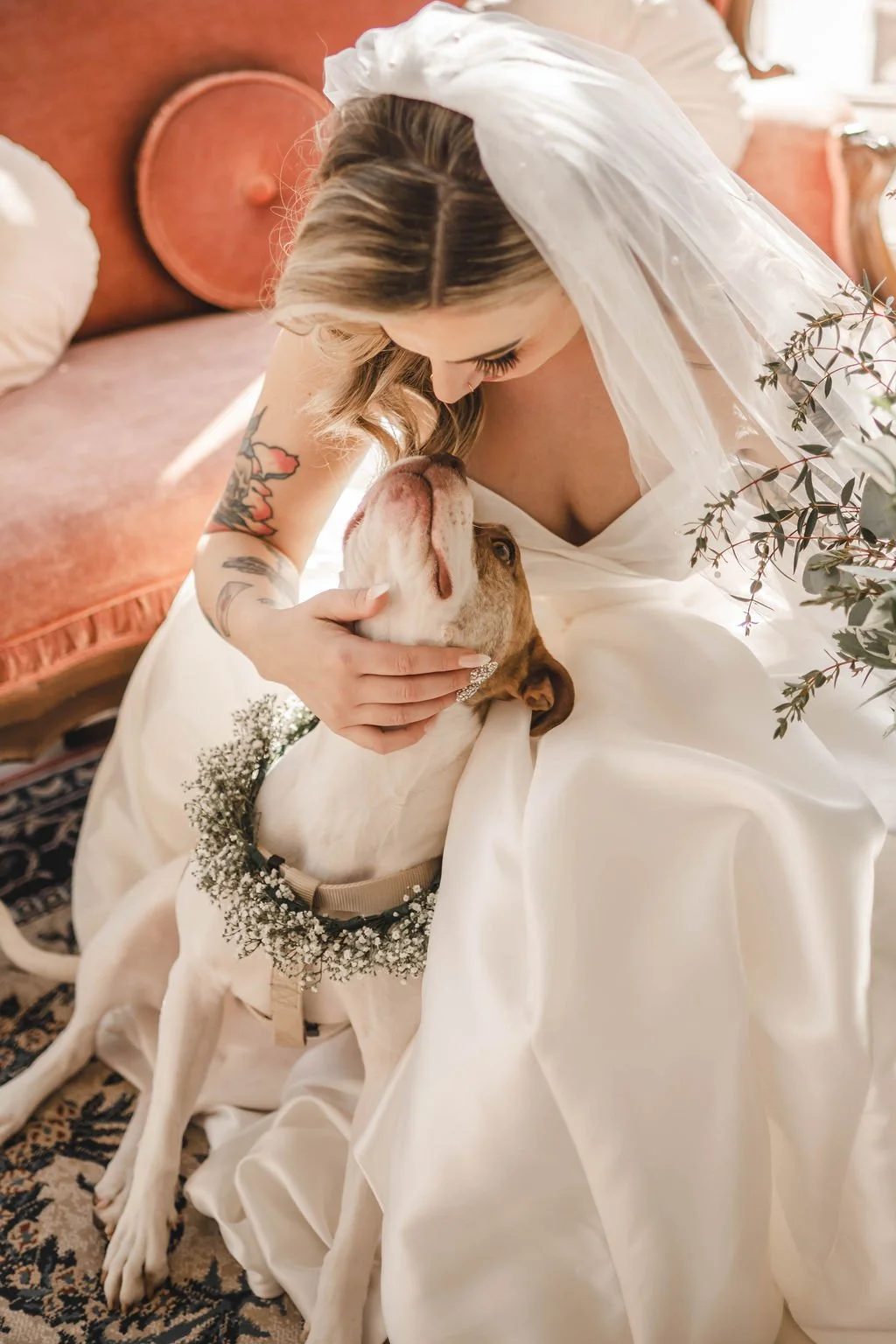 Bride loving on her dog during wedding at Lehmann Mansion in Lake Villa wedding coordinated by Wags of Love.