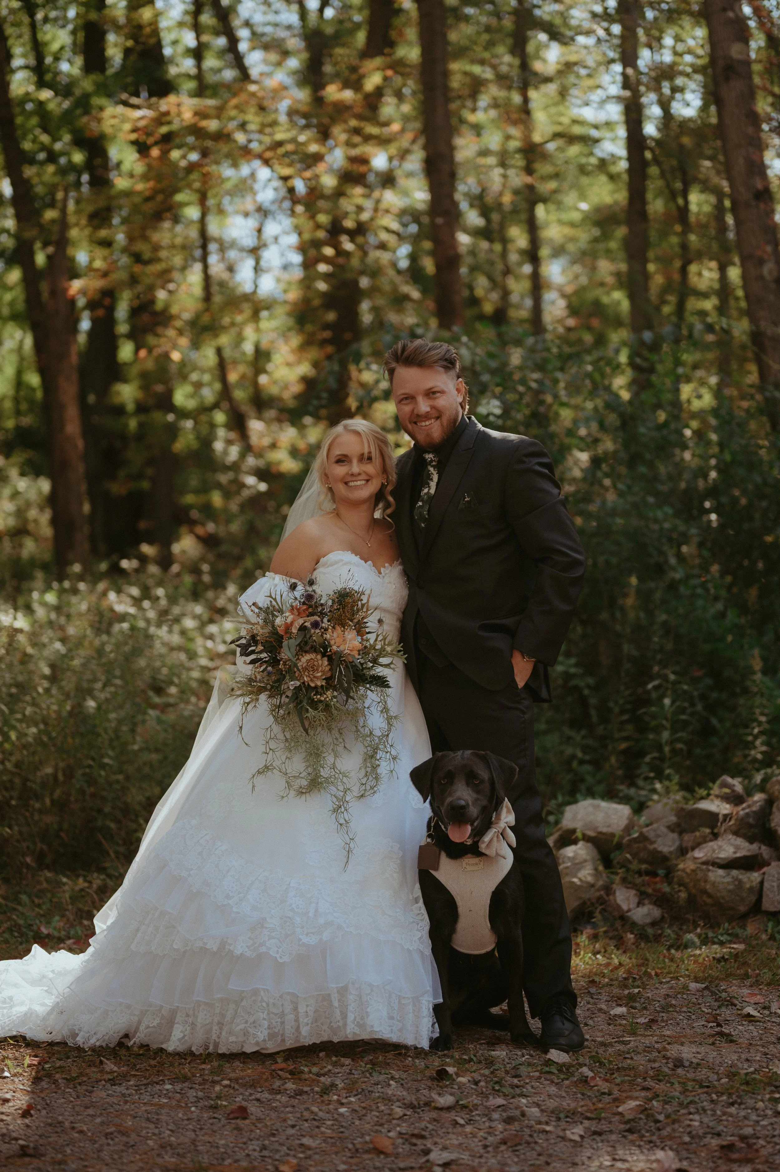Bride and groom with their dog at romantic Wisconsin outdoor wedding.