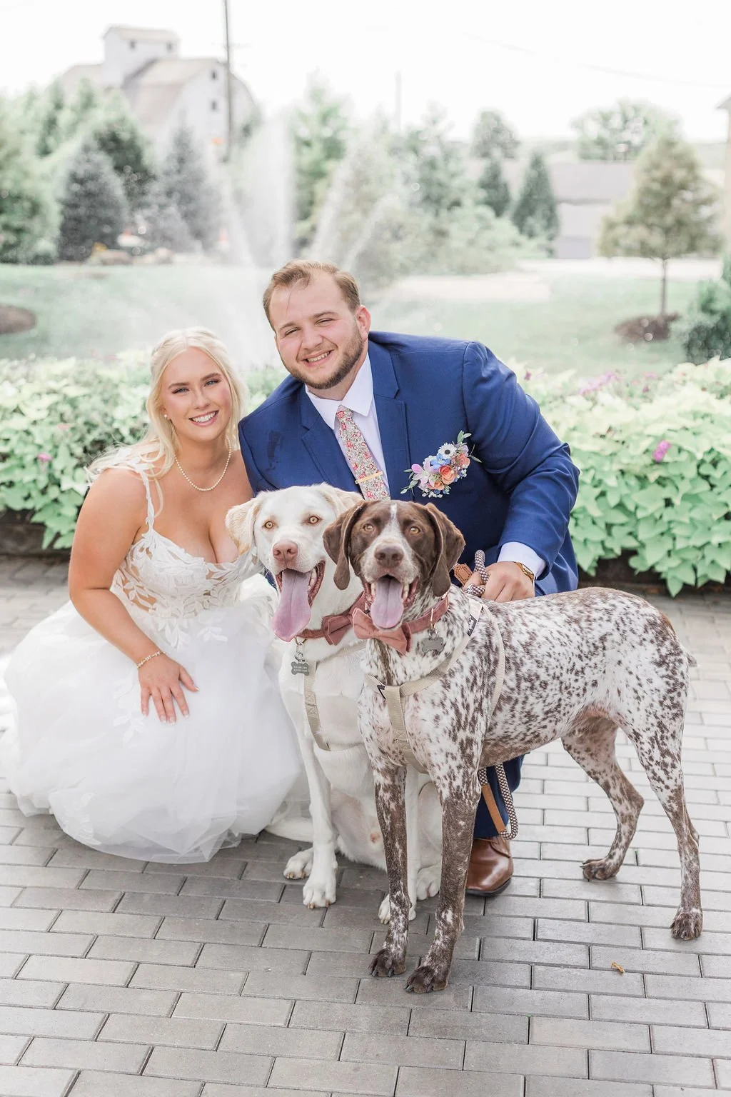 Wags of Love professional pet wedding service helping couple get photo with dogs during wedding at The Farmhouse in Plainfield.