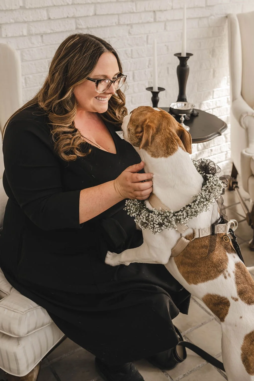 Wags of Love loving and petting dog at wedding while caring for them during wedding in Chicago. 