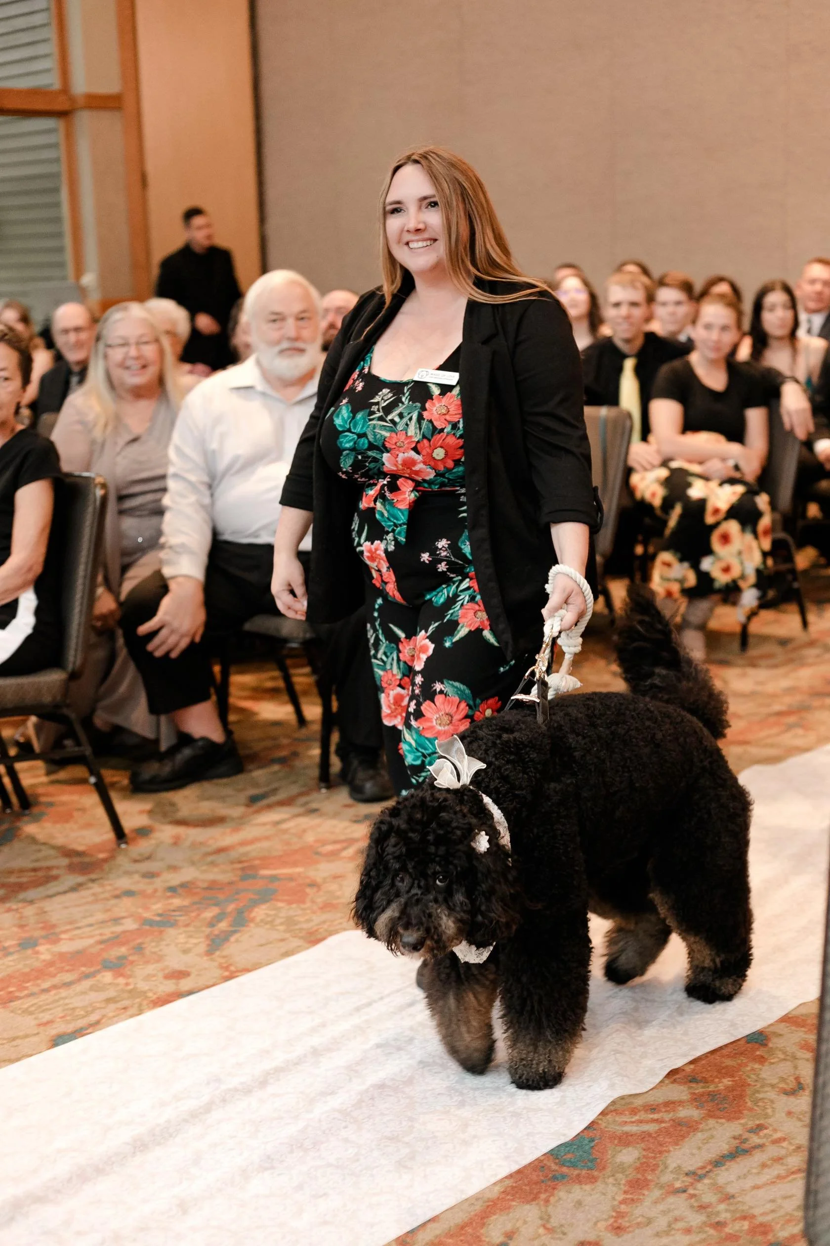 Dog happily playing with flower girl at Chicagoland wedding ceremony.