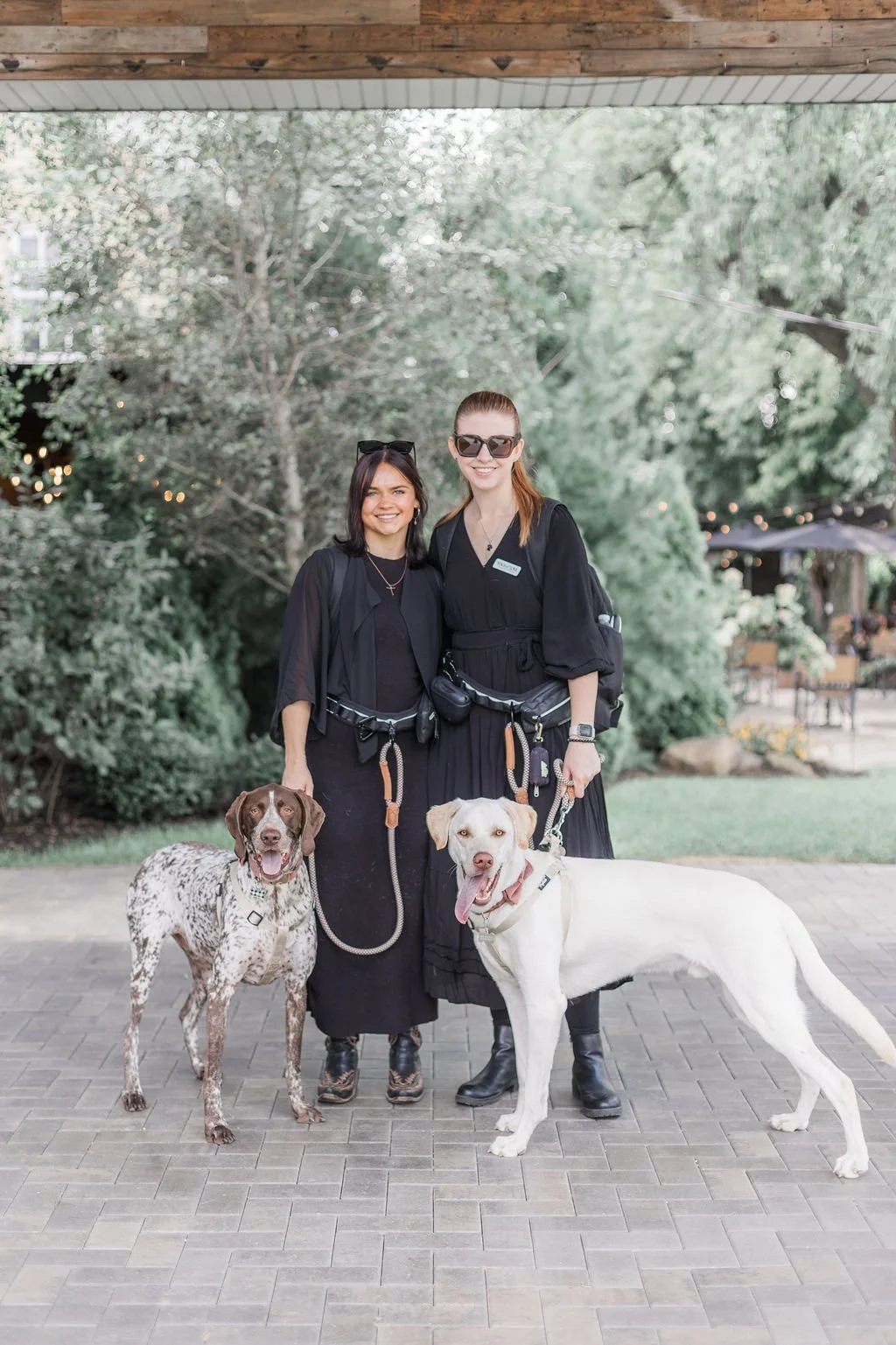 Wags of Love team smiling with dogs at The Farmhouse in Plainfield wedding.