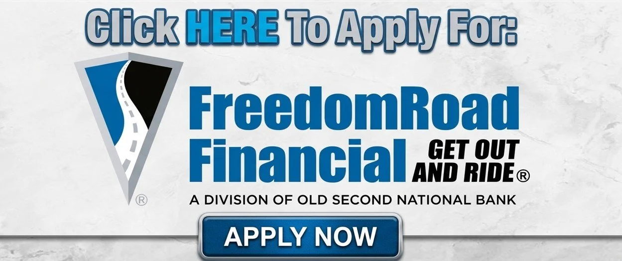 A promotional graphic with text encouraging viewers to apply for a financial service called Freedom Road Financial, a division of Old Second National Bank. The graphic includes a road logo, bold blue text, and a button labeled 'Apply Now'.
