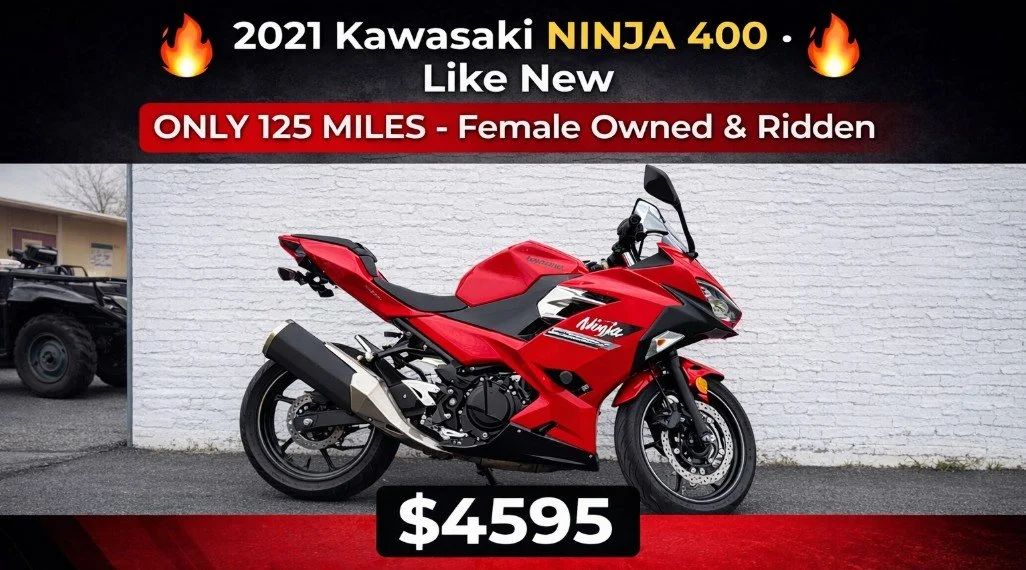 Red 2021 Kawasaki Ninja 400 motorcycle parked against a white brick wall, with promotional text highlighting its features and price of $4595.