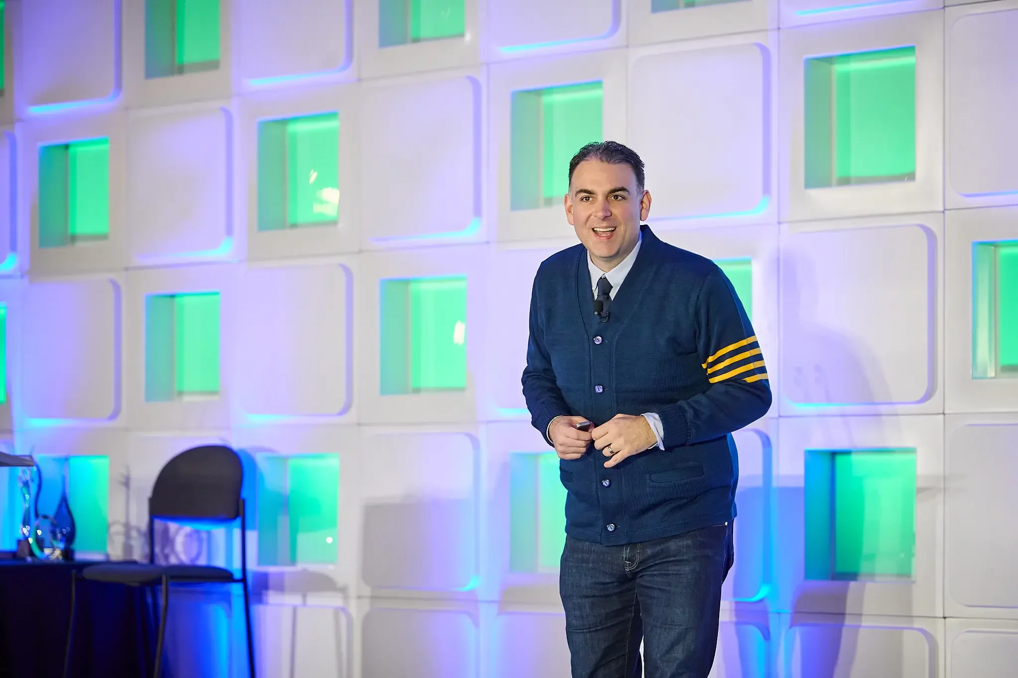 Mark Mohammadpour is speaking at a finance conference.